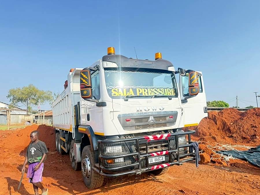 White tipper truck with Sala Pressure windscreen banner.